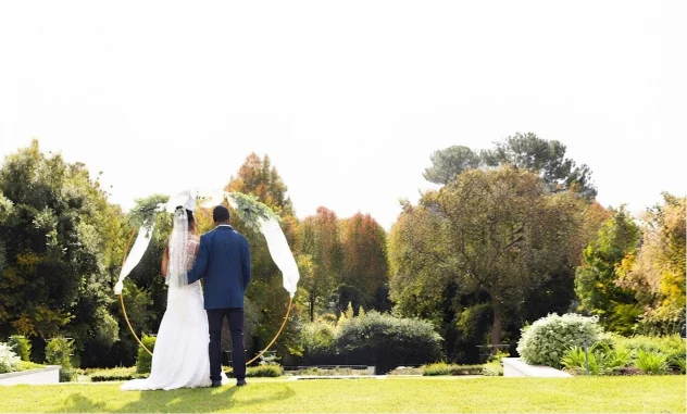 Bride and groom at an outdoor wedding ceremony at Briarwood Country Club in Sun City West, AZ